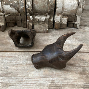 Pair of wooden cattle heads