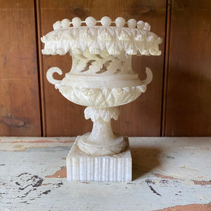 Intricately carved alabaster urn