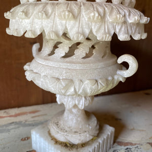Intricately carved alabaster urn
