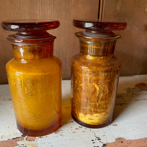 2 amber apothecary bottles with stoppers