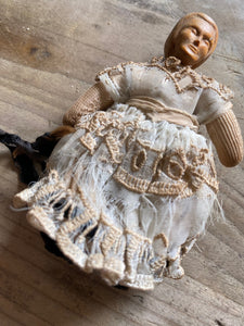 Cloth body doll with carved wood head