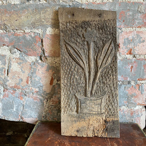 Carved wooden panel: potted plant
