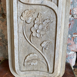 Carved wooden floral panel