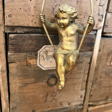 Load image into Gallery viewer, Small bronze cherub/putti on swing
