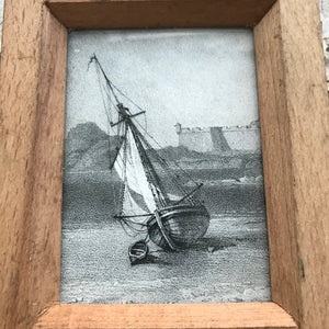 Print of boat in vintage printing frame