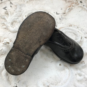 Pair of leather baby shoes