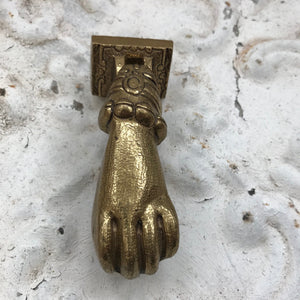 Brass hand knocker