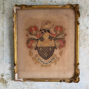 Framed needlepoint coat of arms
