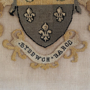 Framed needlepoint coat of arms